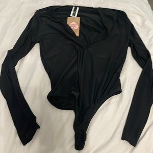 Black body suit never worn size small